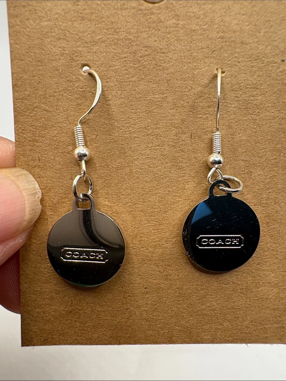 COACH Silver-Tone Earrings with White Logo Discs - Picture 2 of 4